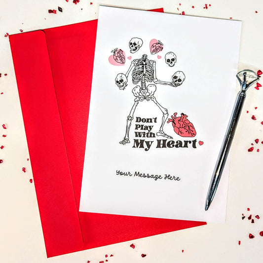 "Don't play with my heart" Alternative Valentine's Day Skeleton Greetings Card with red envelope - posted 1st class in a carded envelope. 250gsm A5 card & C5 envelope - perfect for alternative Skeleton Rock chick, Gory alternative to Soppy Valentine's Day